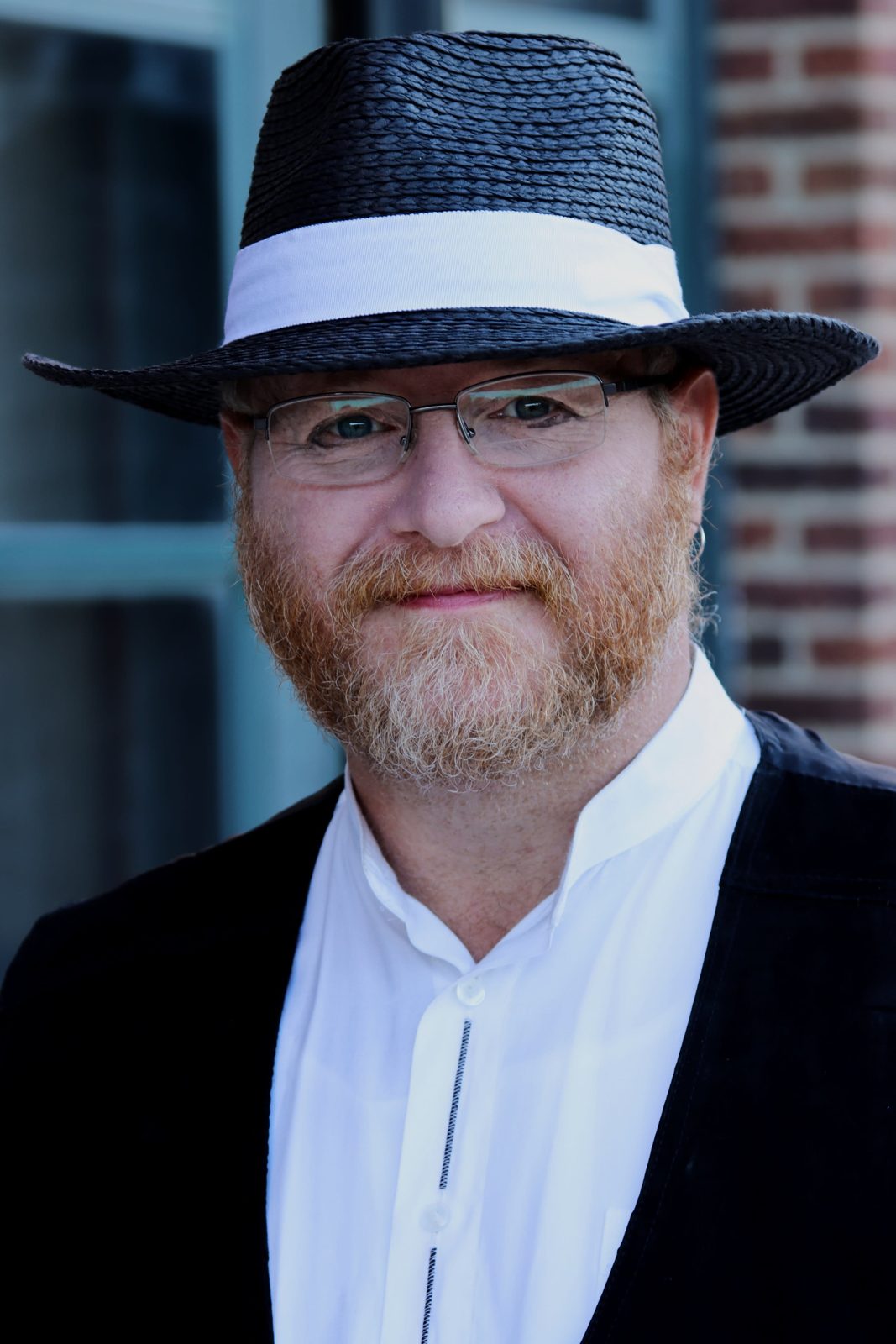 Character-driven portrait of a bearded professional in a hat, Charleston IL headshot photographer