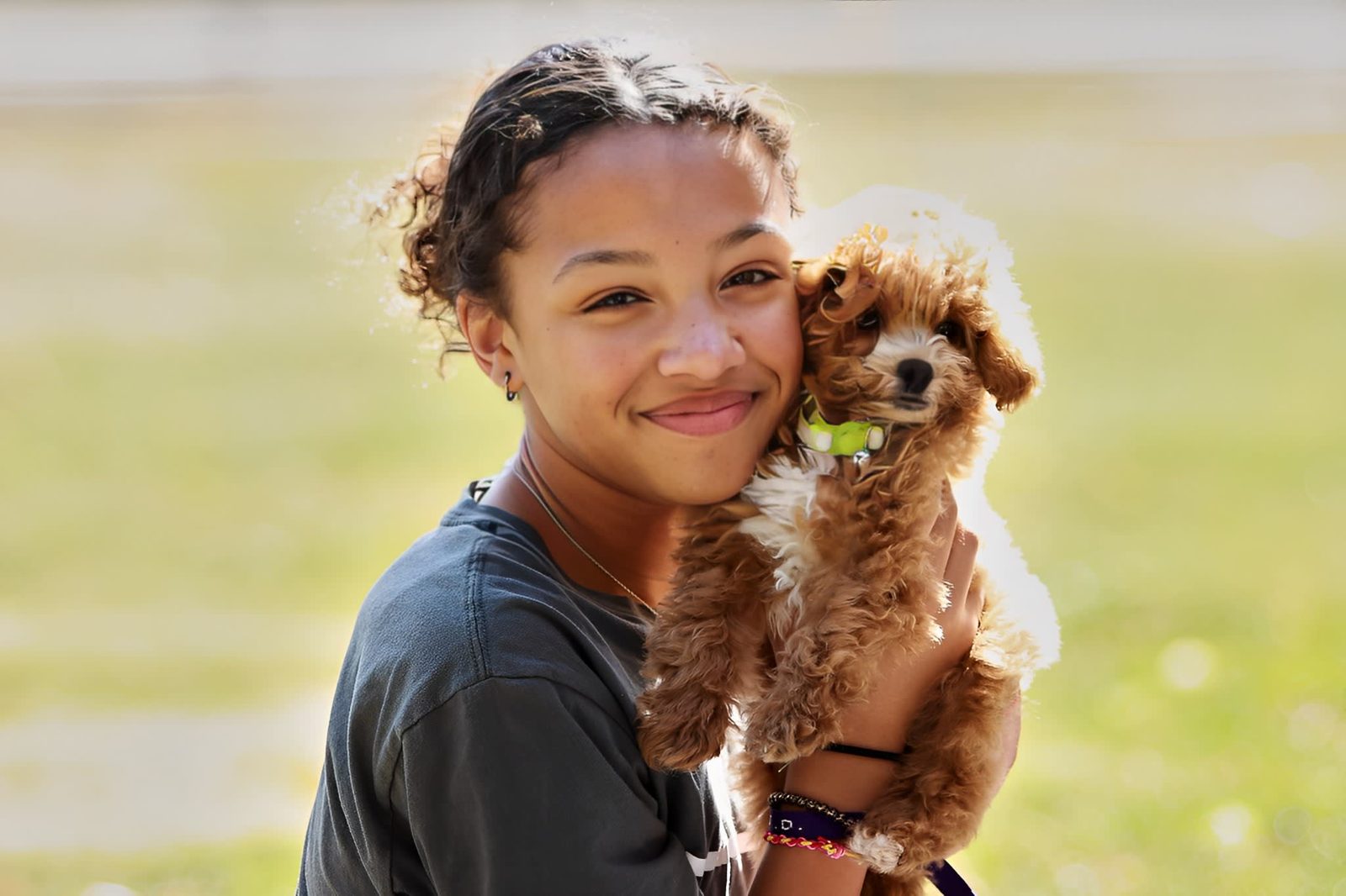 Lifestyle portrait of a young woman with her dog outdoors in Mattoon, Illinois